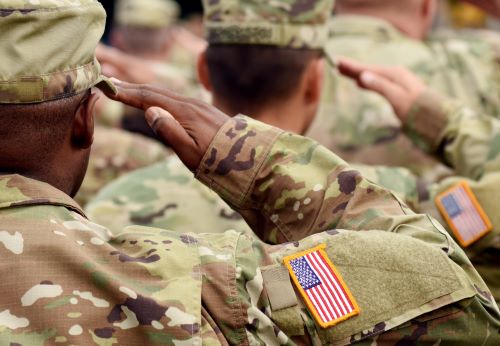 military personnel saluting